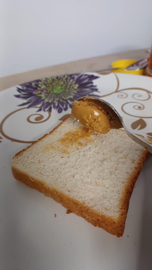 spreading-peanut-butter-to-bread