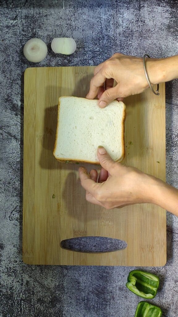 placing the bread slices on top of each other