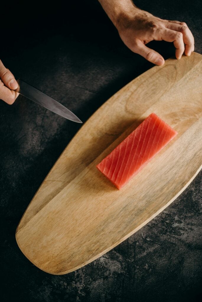cutting-the-sashimi grade-tuna-with-a-knife
