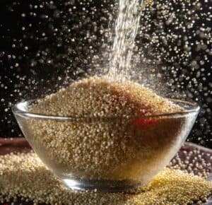 rinsing-quinoa-with-water-in-a-glass-bowl