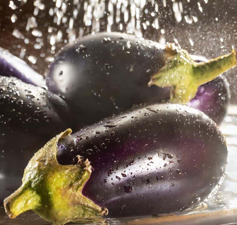 washing-eggplants-in-water